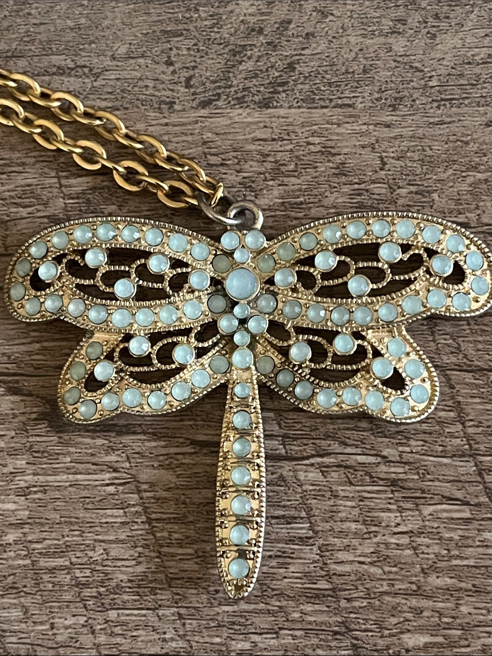 vintage-inspired brass dragonfly necklace featuring mint green bead 17”